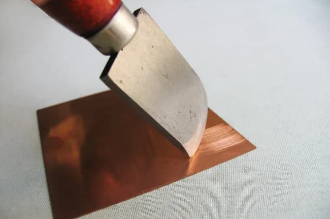 A second rocker with a red handle laid over at a steeper angle against the plate.