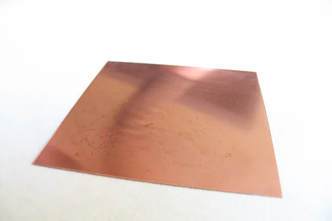 The copper plate bare and still bright, marked only with a few faint scratches.