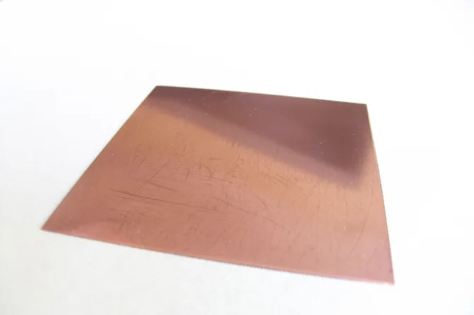 The plate duller, its surface crossed by the first passes of the rocker.